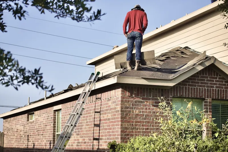 Professional roofer working on a residential roof in Irving Heritage District